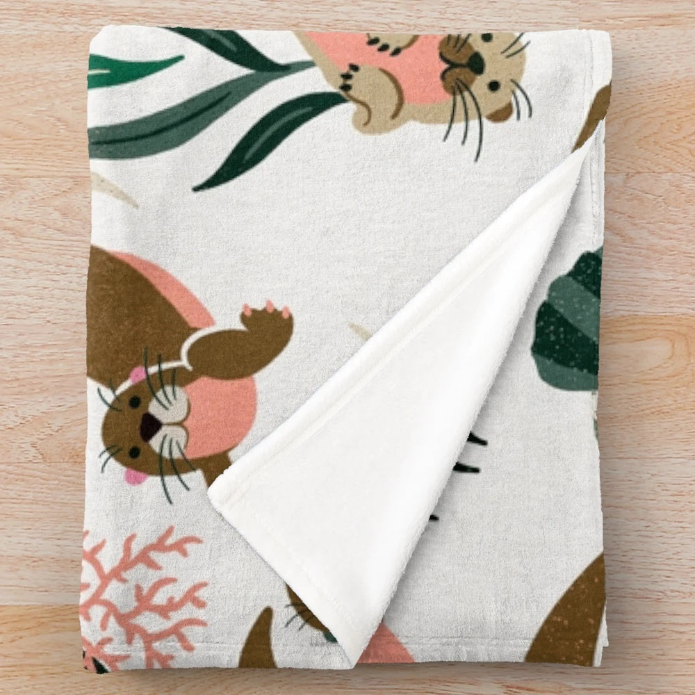 Otter-themed plush blanket