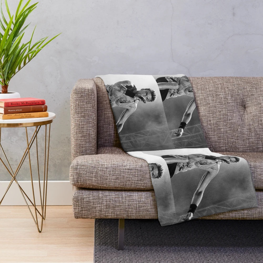 Soft and cozy plush blanket with black and white design, perfect for music fans