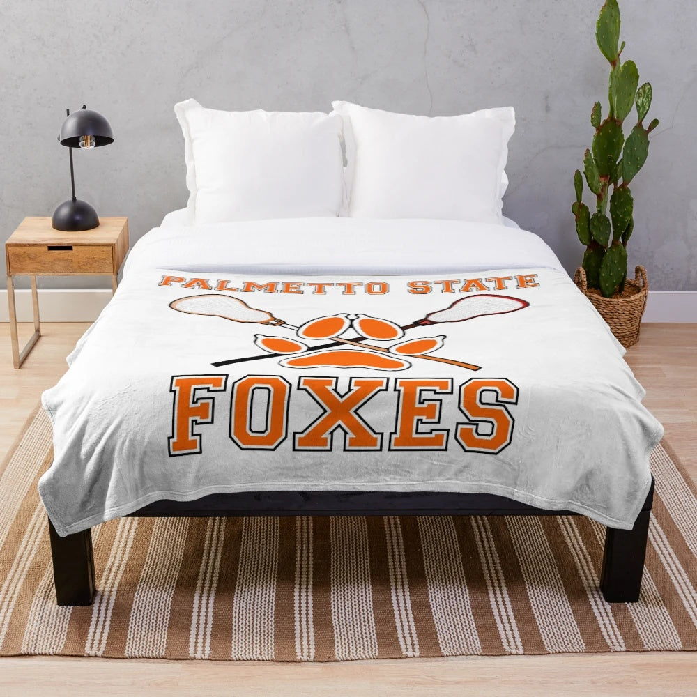 Plush blanket featuring the Palmetto State Foxes crest design