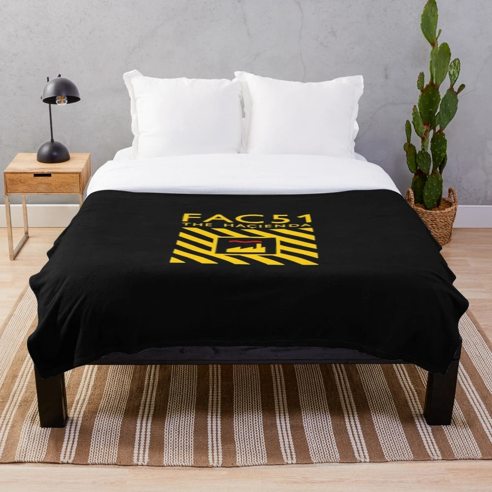 Plush blanket with The Hacienda logo and essential merchandise design