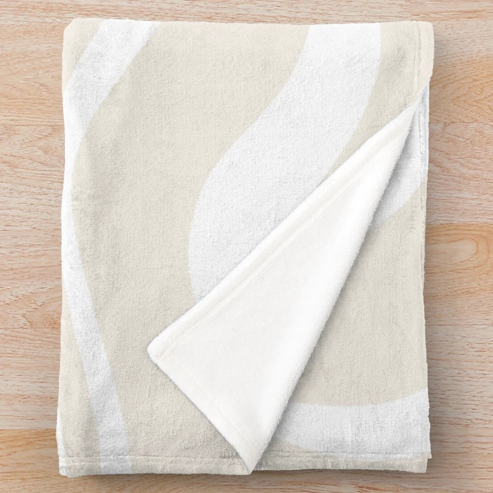 Plush blanket with a light beige and white abstract swirl pattern