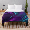 Soft and plush blanket with a swirling teal and purple pattern