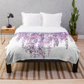 Plush blanket with hand-painted purple wisteria flowers in bloom