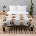 Adorable poodle mix puppy on a soft, plush blanket
