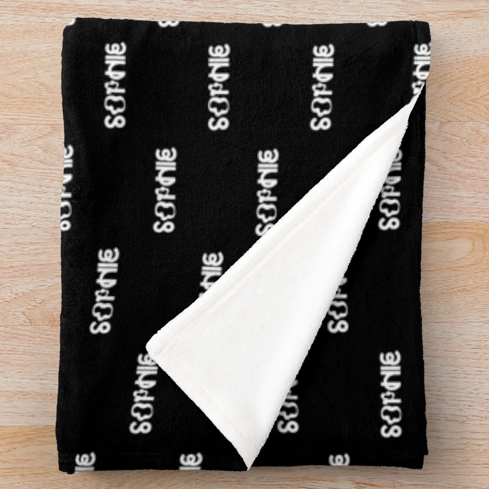 A soft and cozy plush blanket featuring the Sophie logo and design elements