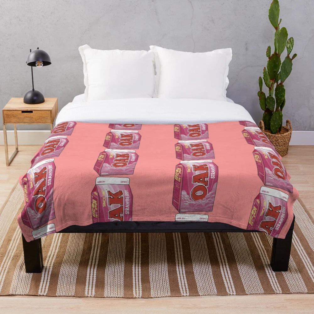 Soft and cozy strawberry milk-themed plush blanket with a pastel aesthetic design