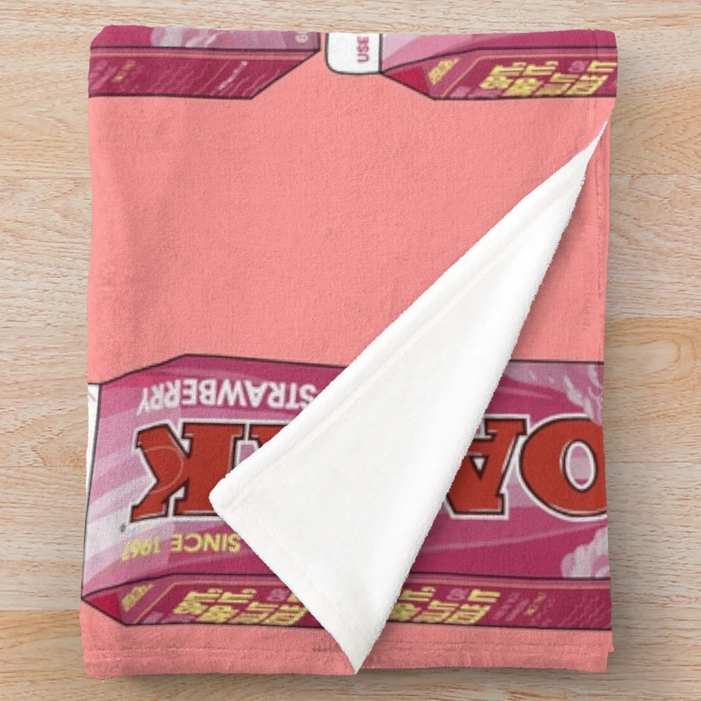 Soft and cozy strawberry milk-themed plush blanket with a pastel aesthetic design