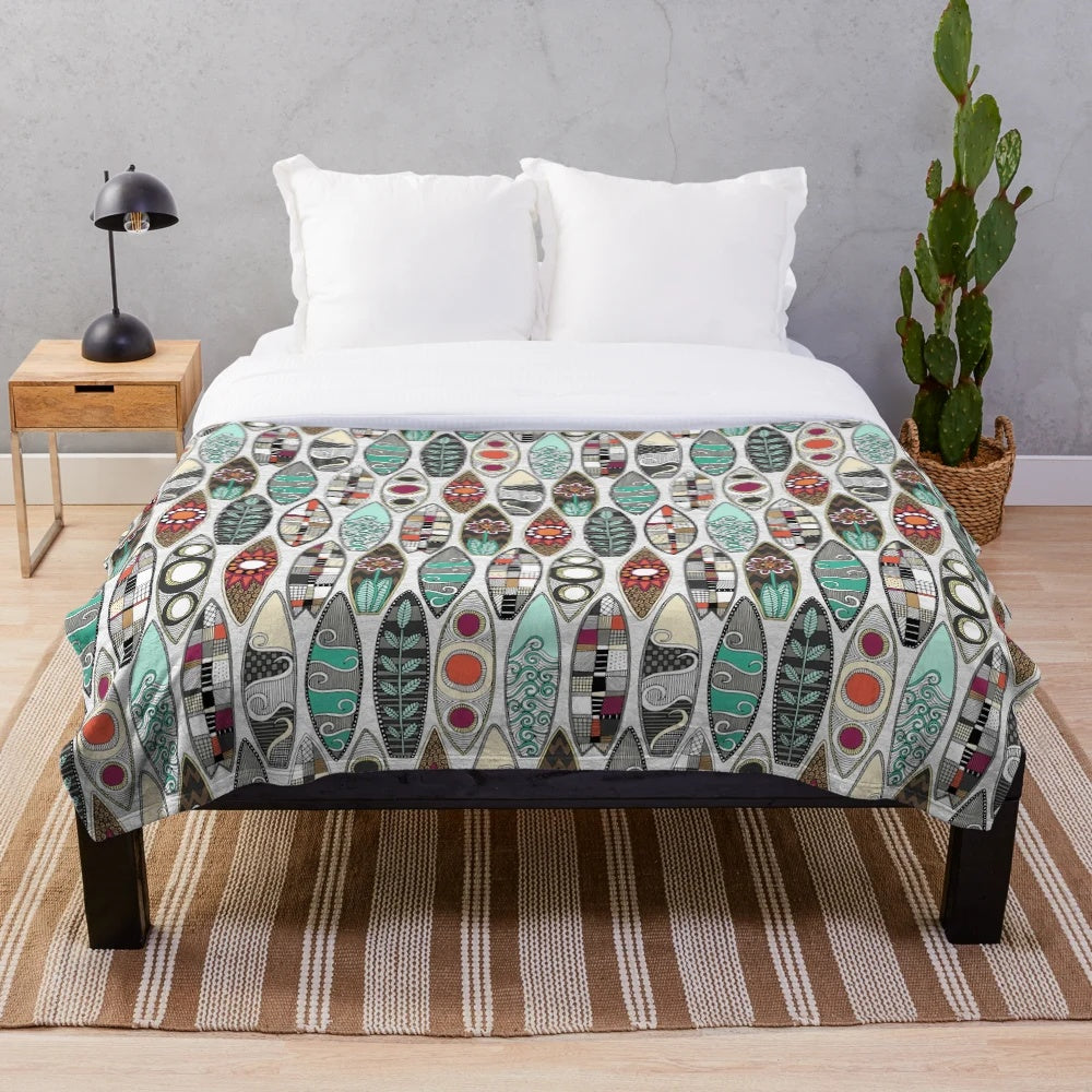 White plush blanket with surfboard graphic design