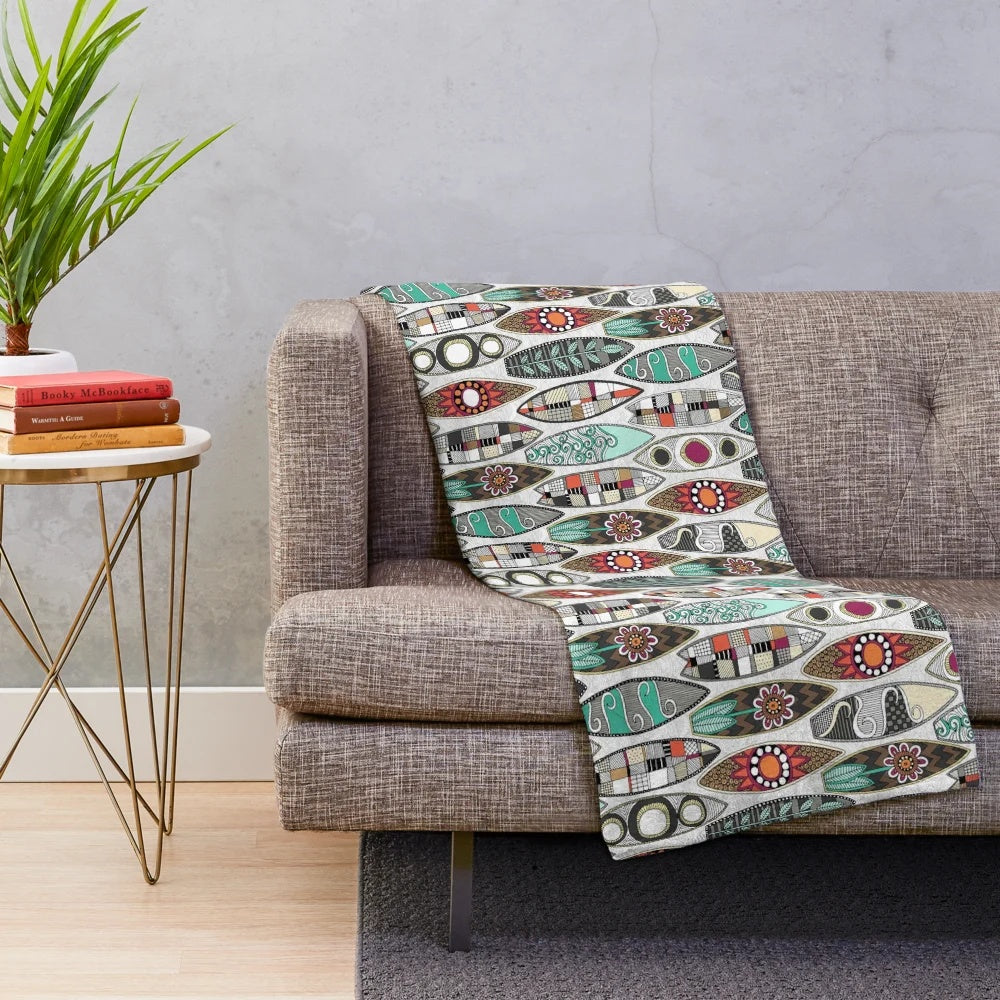 White plush blanket with surfboard graphic design