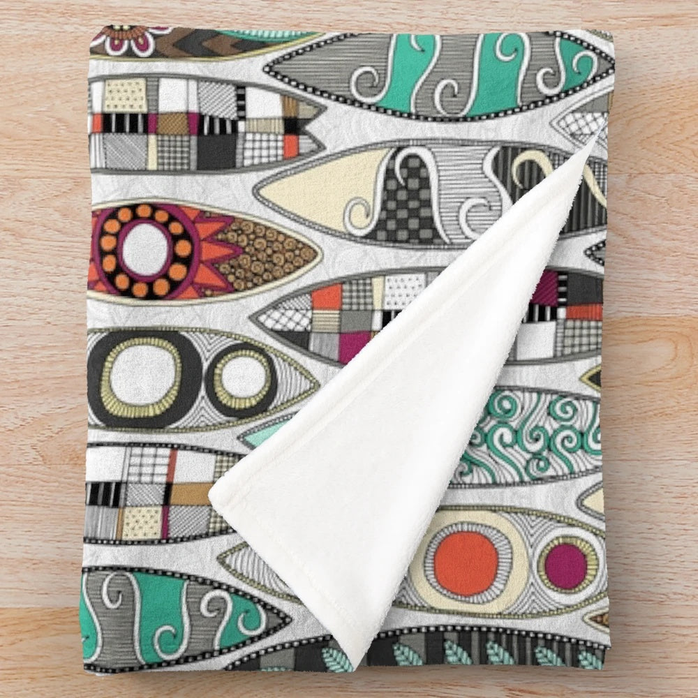 White plush blanket with surfboard graphic design