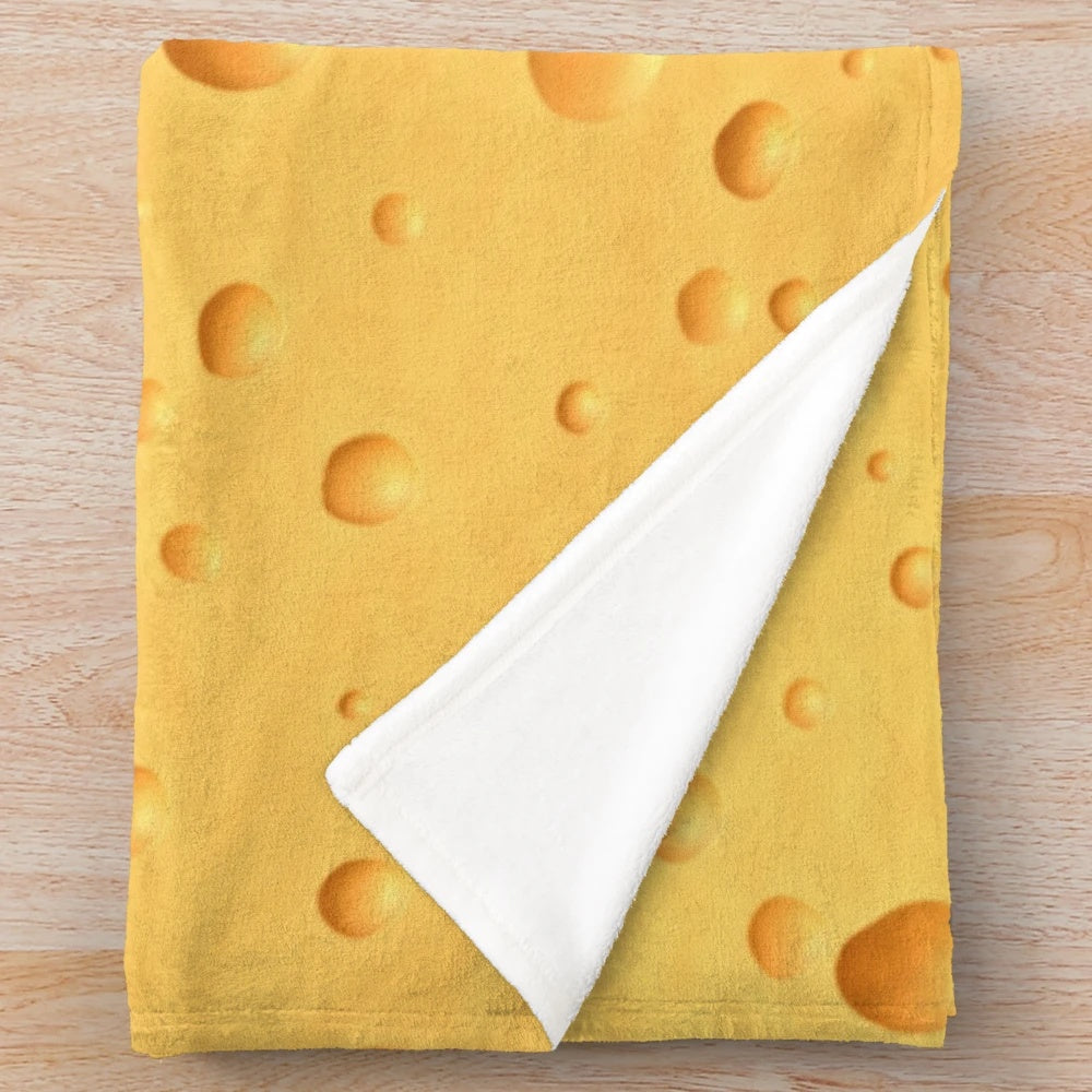 Swiss cheese-themed plush blanket
