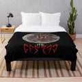 The Hu-inspired plush blanket featuring the band's iconic dragon logo and elements from the Genshin Impact game