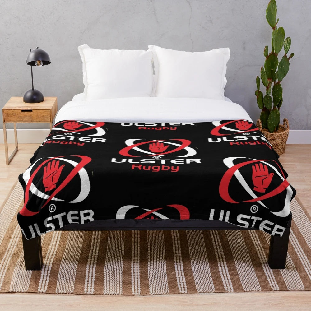 Ulster Rugby-inspired plush blanket with rugby ball and team colors