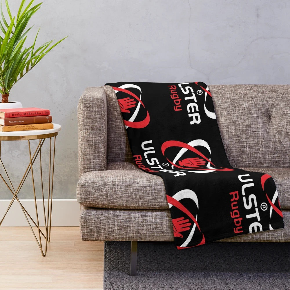 Ulster Rugby-inspired plush blanket with rugby ball and team colors