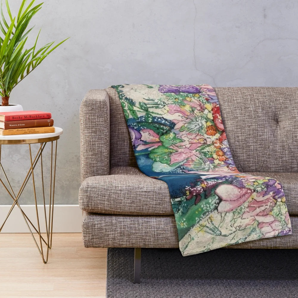 Vase of spring flowers plush blanket with a floral design