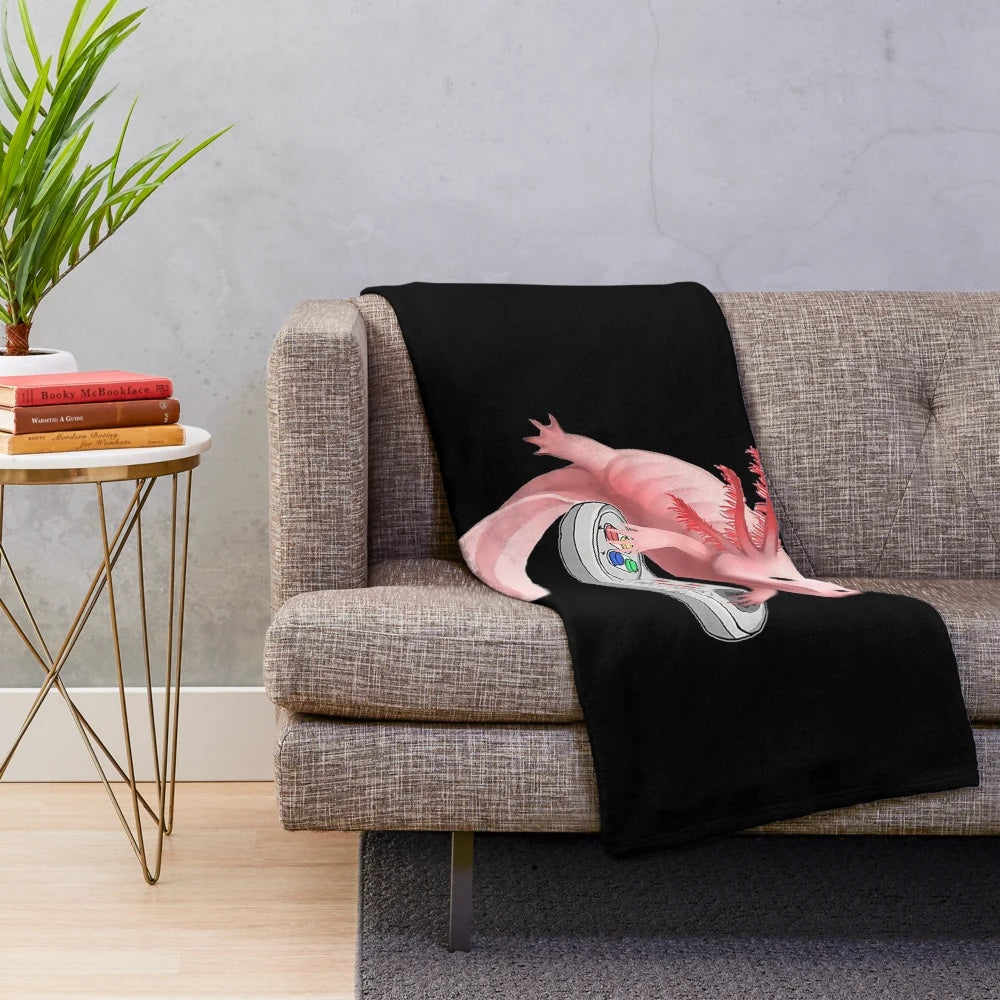 Axolotl plush blanket featuring a white axolotl playing video games