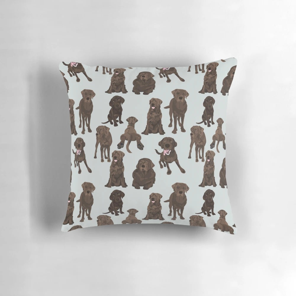 Adorable chocolate labrador retriever dog on a plush pillow