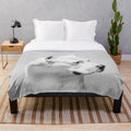 Dogo Argentino dog portrait on a soft, fluffy plush blanket