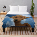 Golden doodle plush blanket with blue sky and clouds