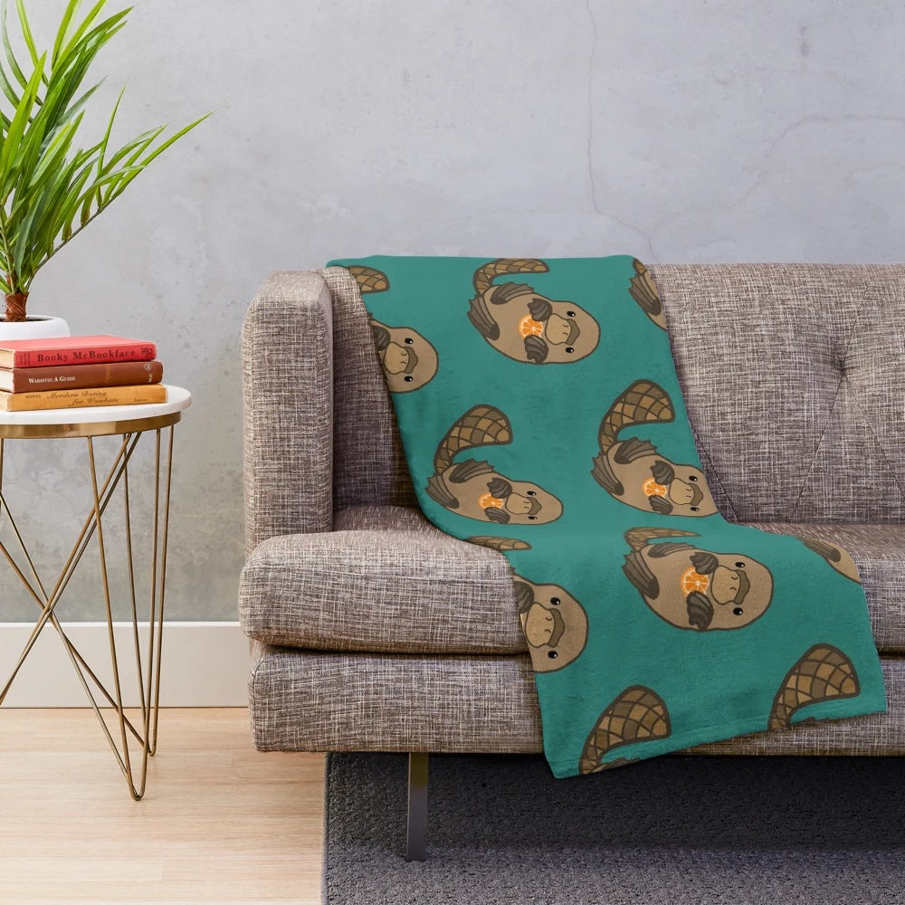 Orange plush blanket with a cute platypus design