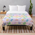 Pastel rainbow plush blanket with soft furry animal design