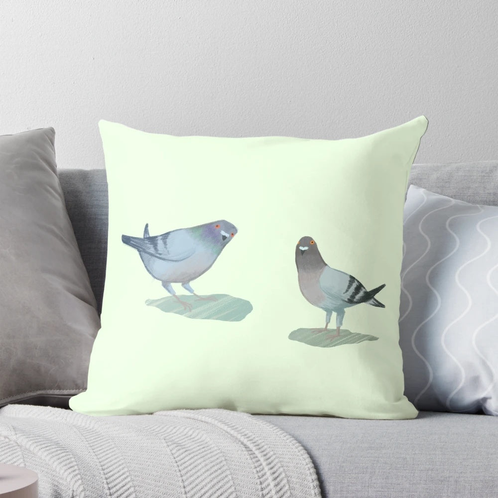 A cozy throw pillow featuring a pair of adorable pigeons in a natural setting.