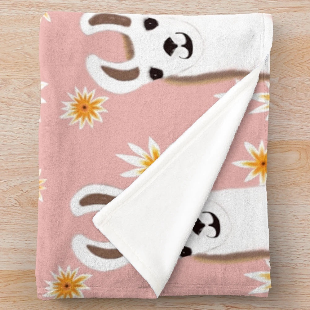 Pink plush blanket with a cute llama design