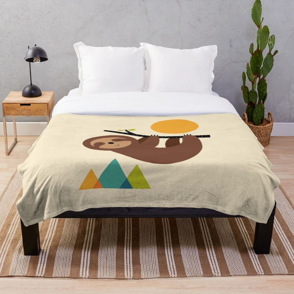 Soft and cozy plush blanket with a relaxing sloth design