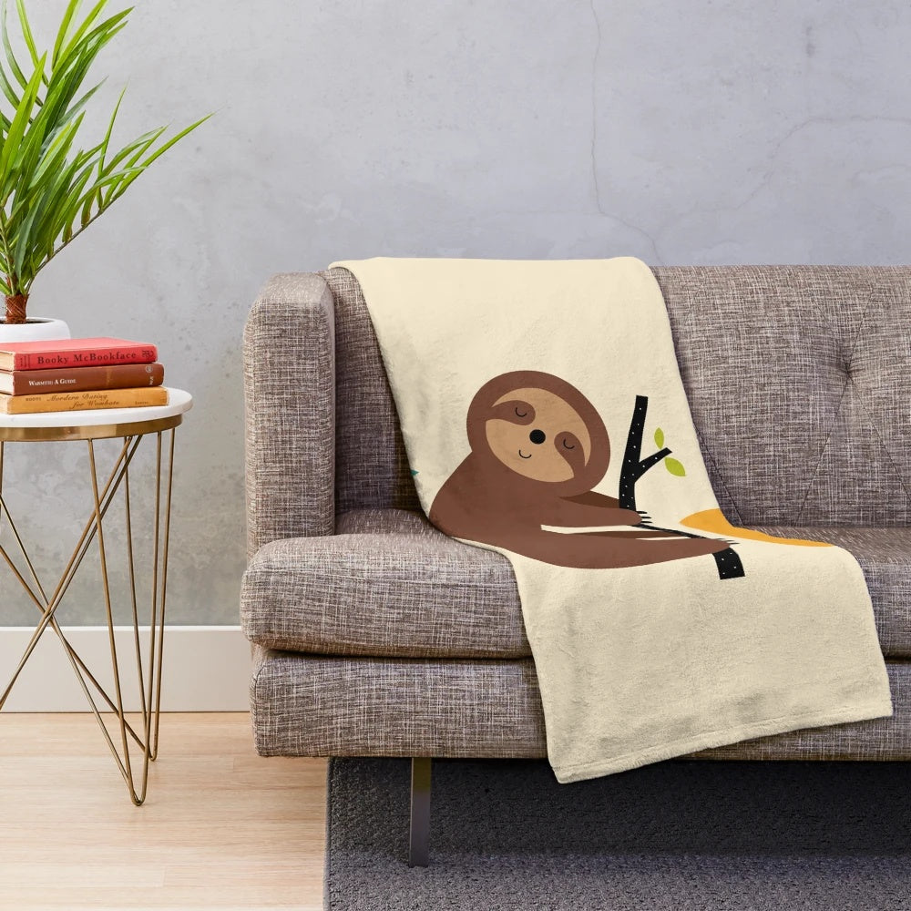 Soft and cozy plush blanket with a relaxing sloth design