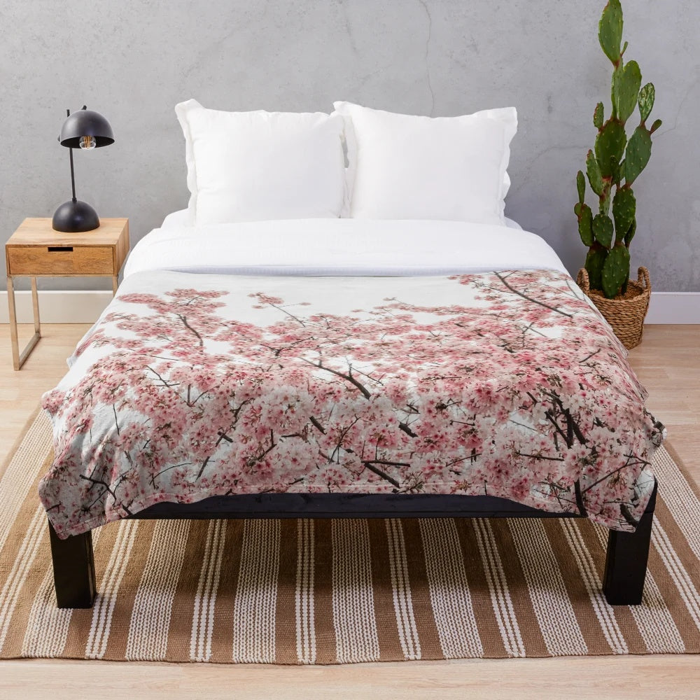 Soft and cozy plush blanket with a minimalist Japanese cherry blossom design