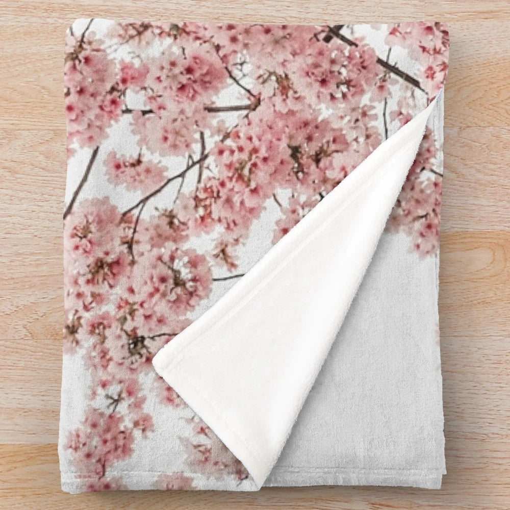 Soft and cozy plush blanket with a minimalist Japanese cherry blossom design