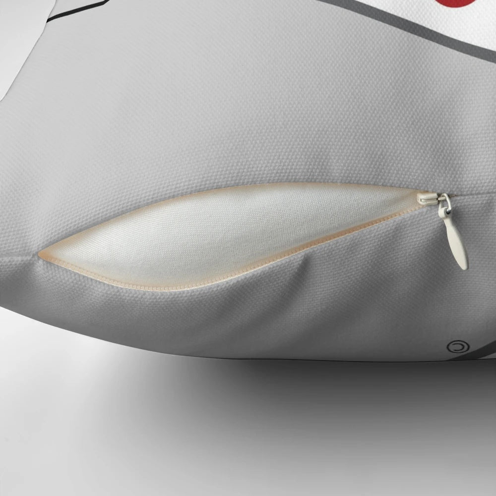Sacred Heart University logo printed on a red and white pillow for laptops and studying.