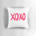 A soft and comfortable decorative throw pillow in a pink and orange XOXO design, perfect for adding a touch of girly style to any room.