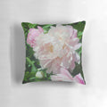 Lush pink peony flowers on a soft, plush throw pillow