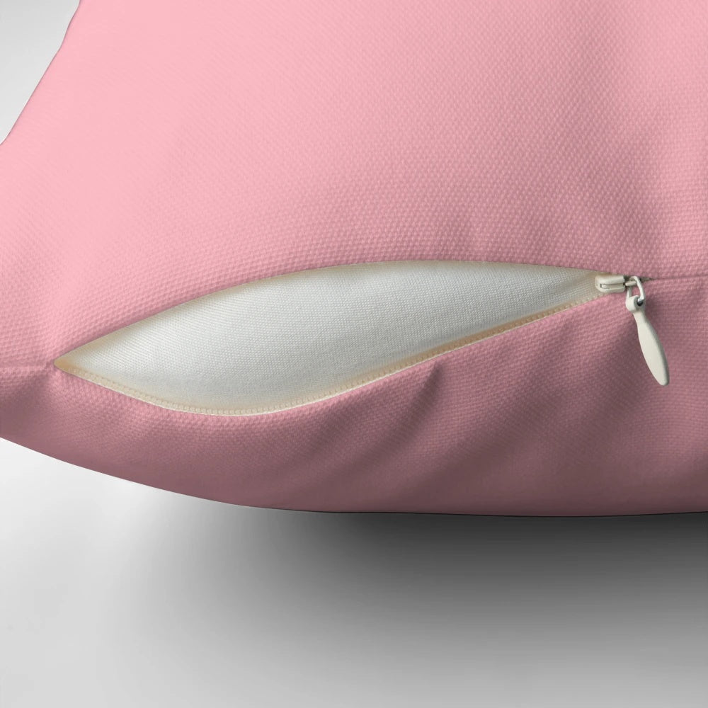 Soft pink pillow with various shades of pink
