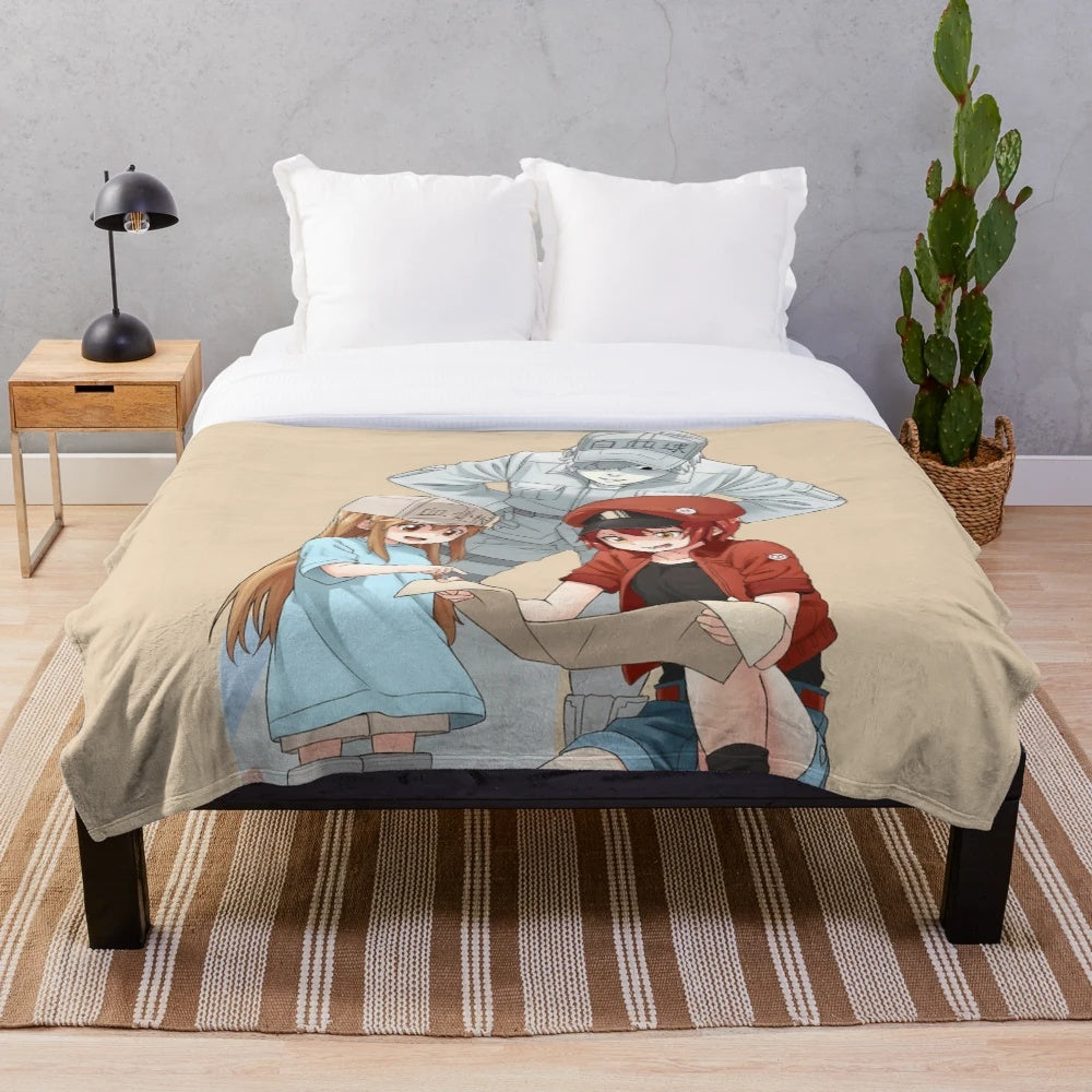 Cells at Work plush blanket featuring red blood cells, white blood cells, and platelets