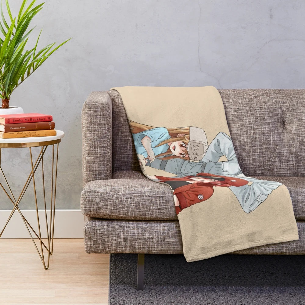 Cells at Work plush blanket featuring red blood cells, white blood cells, and platelets