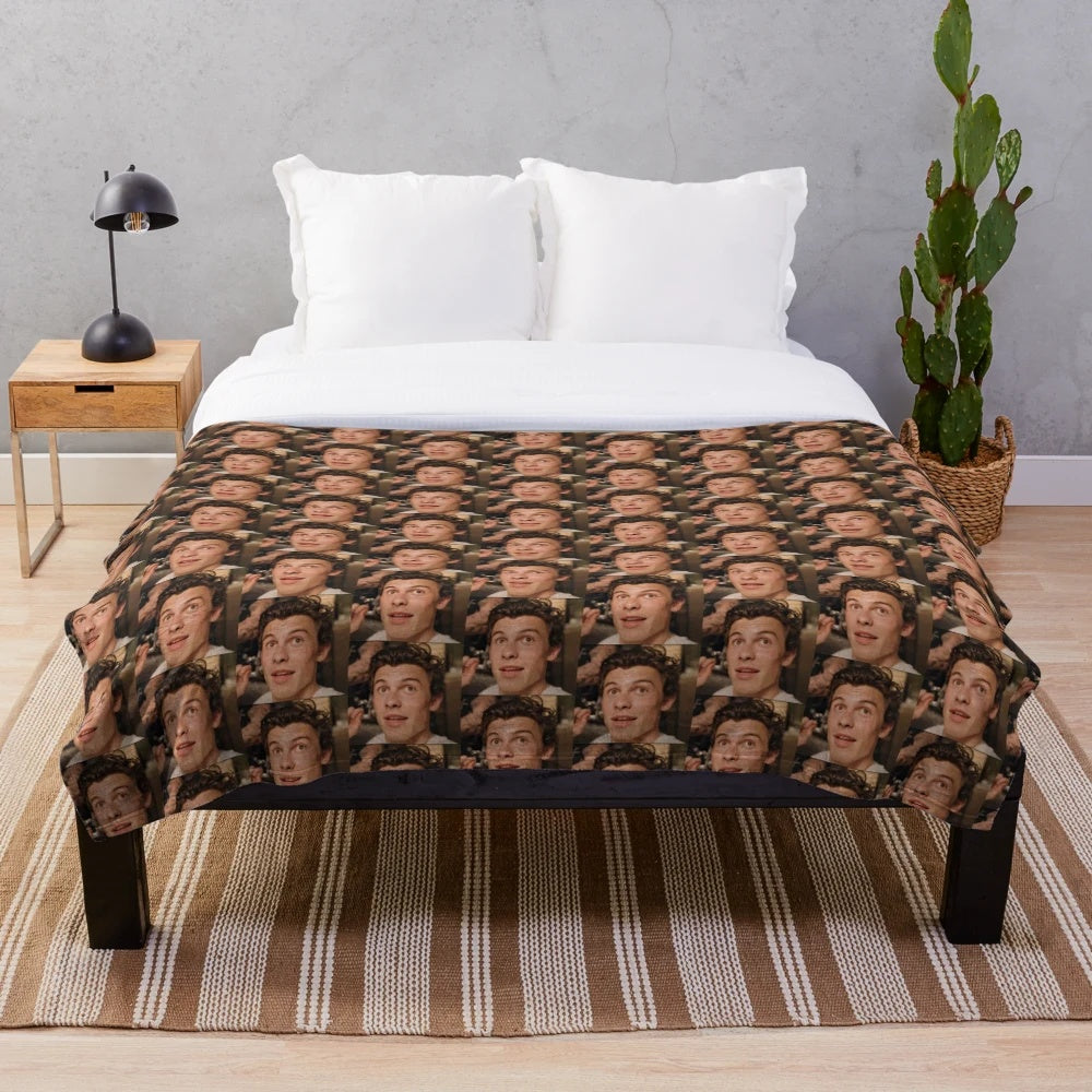 Soft and cozy plush blanket featuring a baby angel design inspired by singer Shawn Mendes