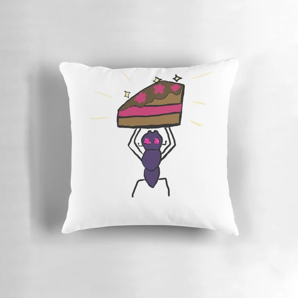 Soft, plush pillow with a cake and ant design, perfect for decorating and cuddling.