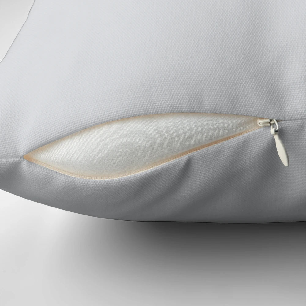 A light grey, minimalist pillow with a soft, luxurious feel.