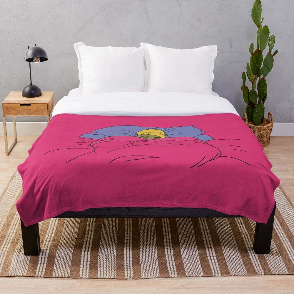 Soft and cozy plush blanket in the shape of a cinnamon bun