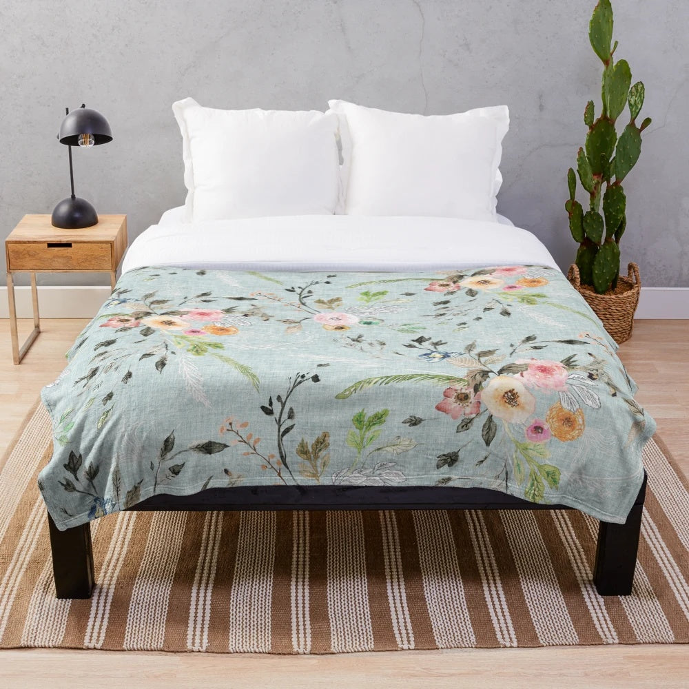 Soft and delicate blue floral plush blanket for a romantic, boho-inspired bedroom