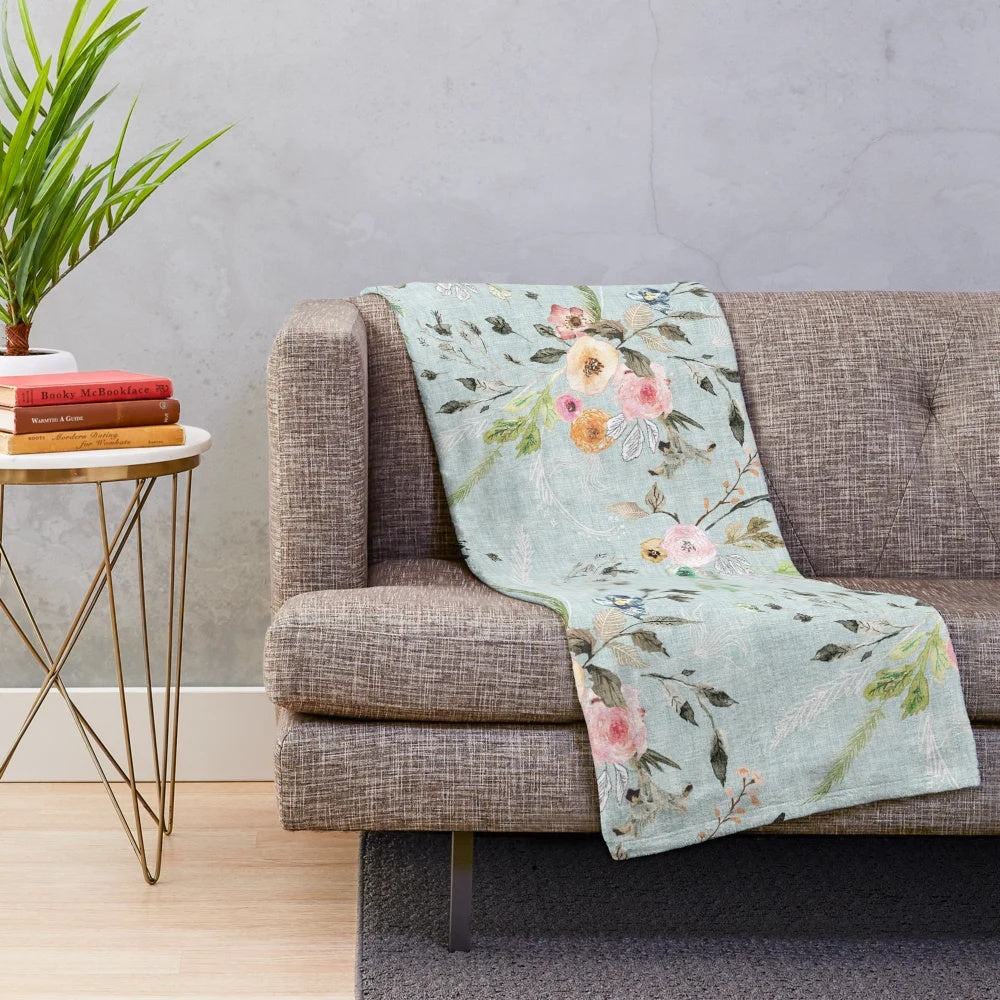 Soft and delicate blue floral plush blanket for a romantic, boho-inspired bedroom