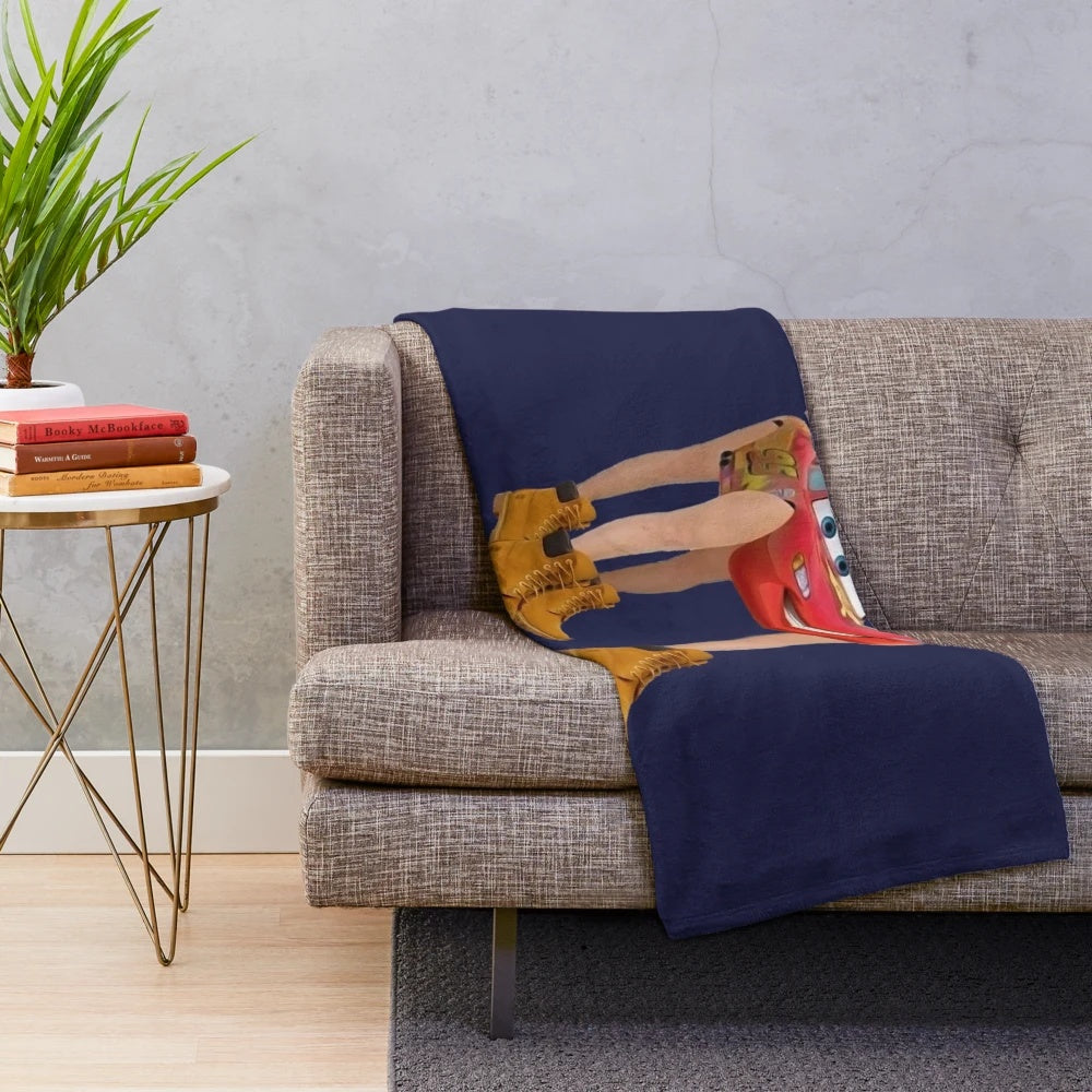 Soft and cozy plush blanket featuring a design of the character Lightning McQueen from the Cars movie