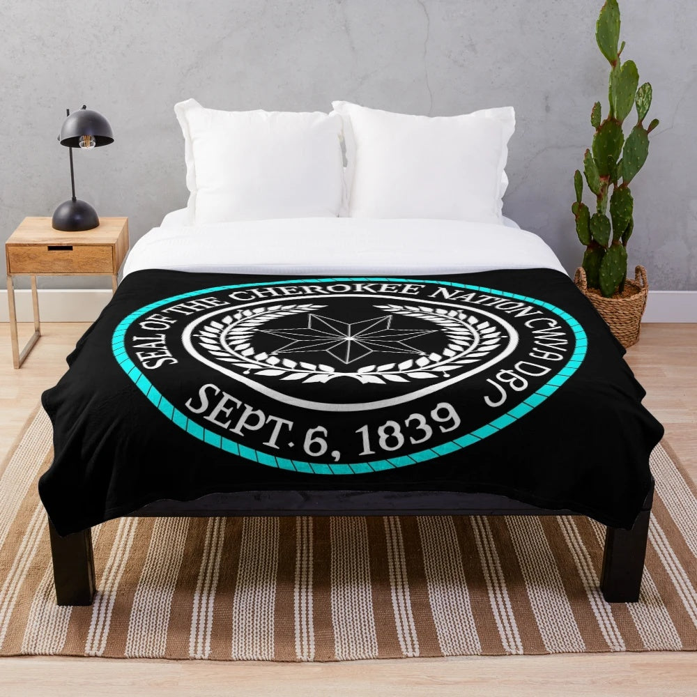 Soft and cozy plush blanket featuring the Cherokee seal design, representing native American pride and heritage.