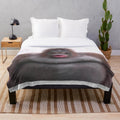 Soft and plush Le Monke blanket with a cute monkey design, perfect for snuggling