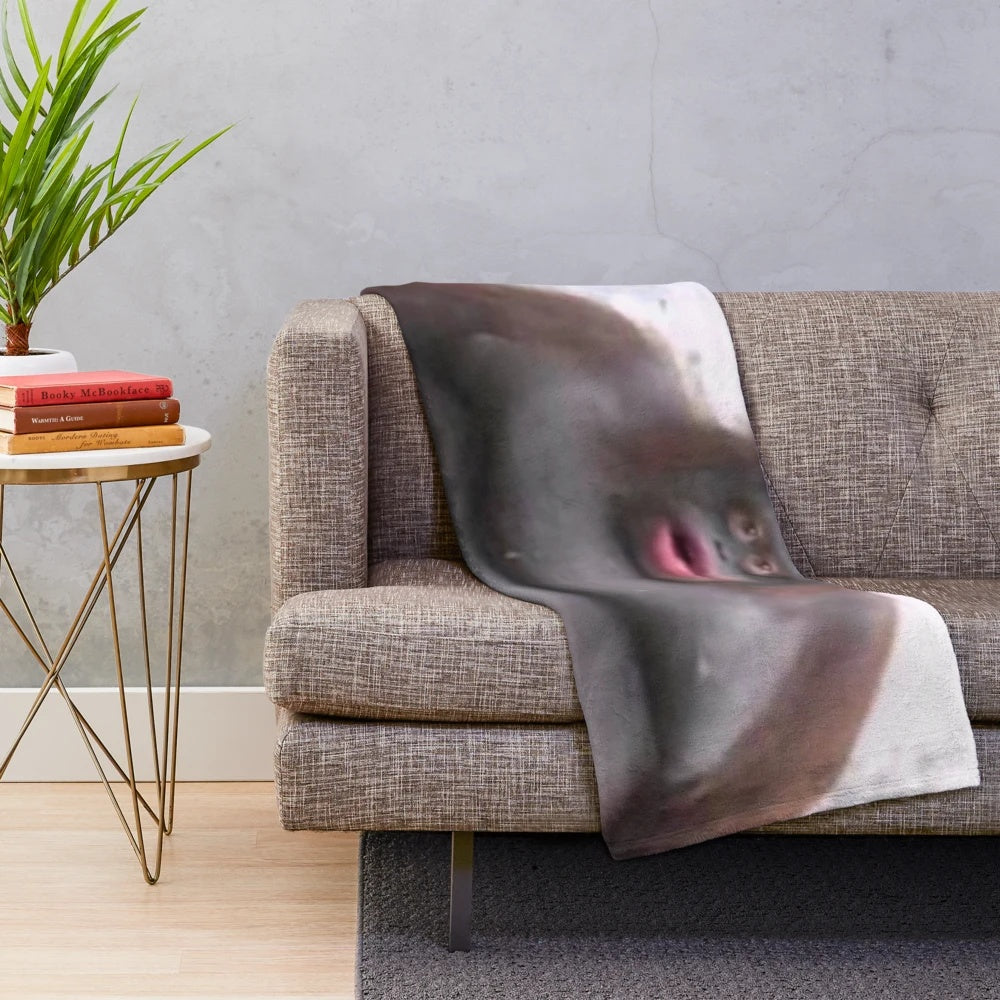 Soft and plush Le Monke blanket with a cute monkey design, perfect for snuggling