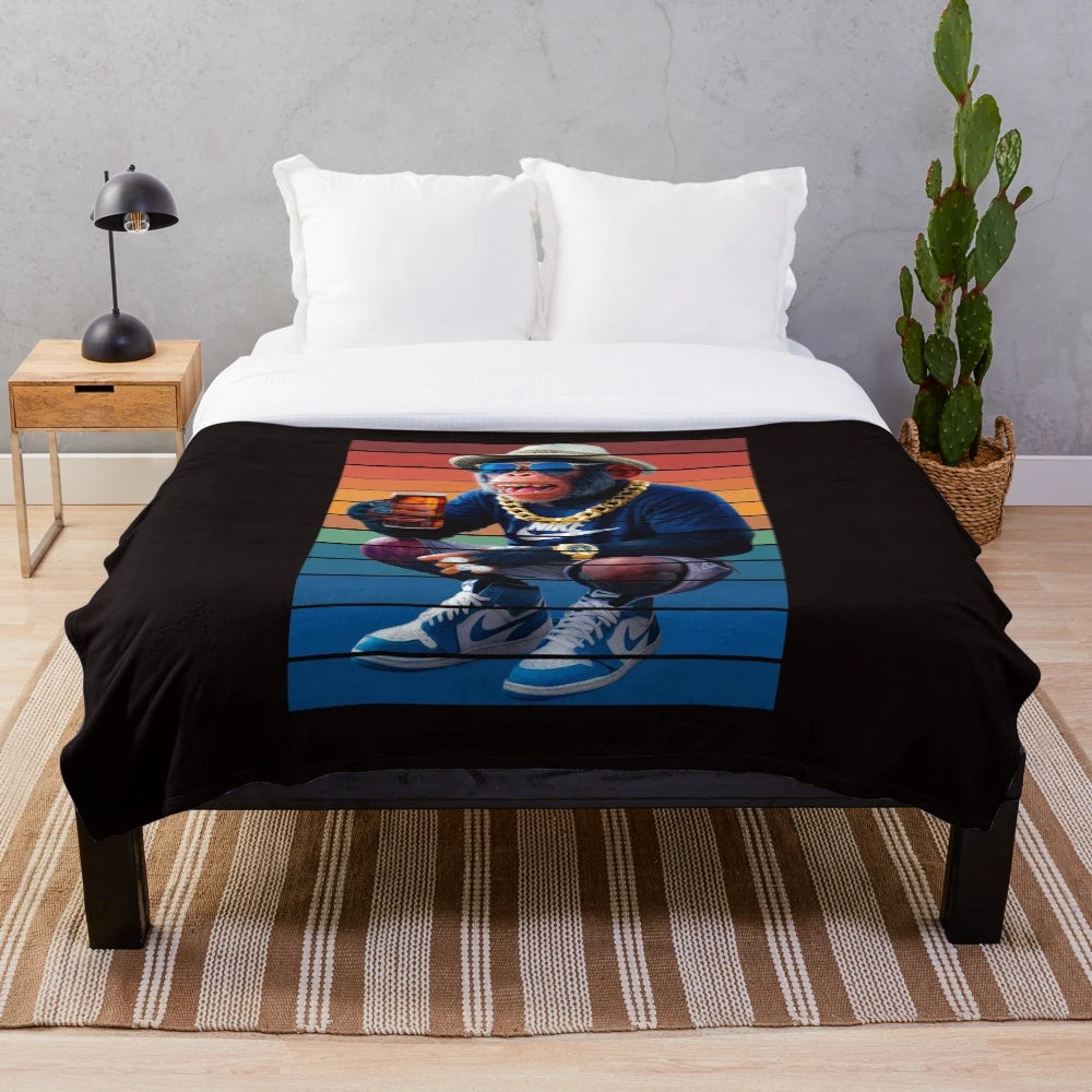 Plush blanket featuring a whimsical monkey sipping a drink