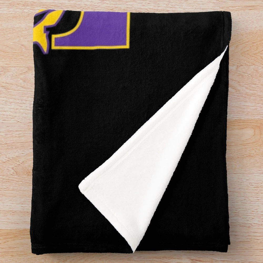 Omega Psi Phi fraternity plush blanket in purple and gold colors