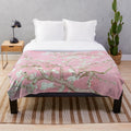 Pale pink plush blanket with floral design inspired by van Gogh's Almond Blossoms